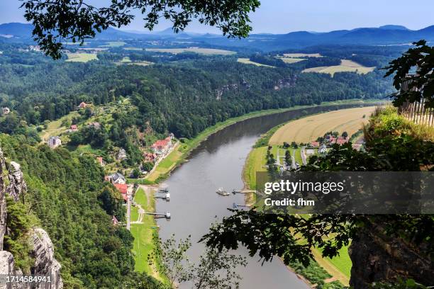 travel destination: elbe sandstone mountains/ with elbe river and rathen village (german: elbsandsteingebirge), saxony/ germany - saxony stock-fotos und bilder