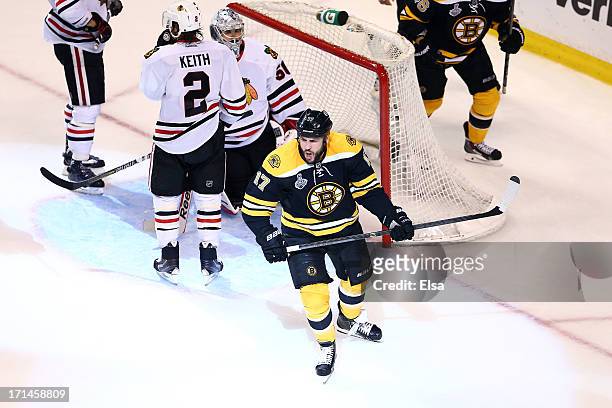 Milan Lucic of the Boston Bruins celebrates after scoring a goal in the third period against Corey Crawford of the Chicago Blackhawks in Game Six of...