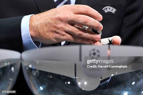 Gianni Infantino, UEFA General Secretary, opens a draw ball during the UEFA Champions League Q2 qualifying round draw at the UEFA headquarters on...