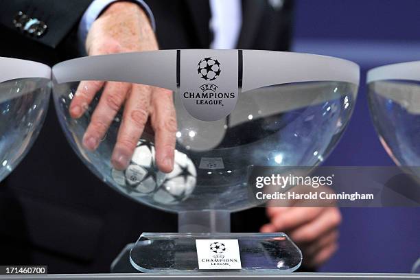 Gianni Infantino, UEFA General Secretary, draws a ball during the UEFA Champions League Q2 qualifying round draw at the UEFA headquarters on June 24,...