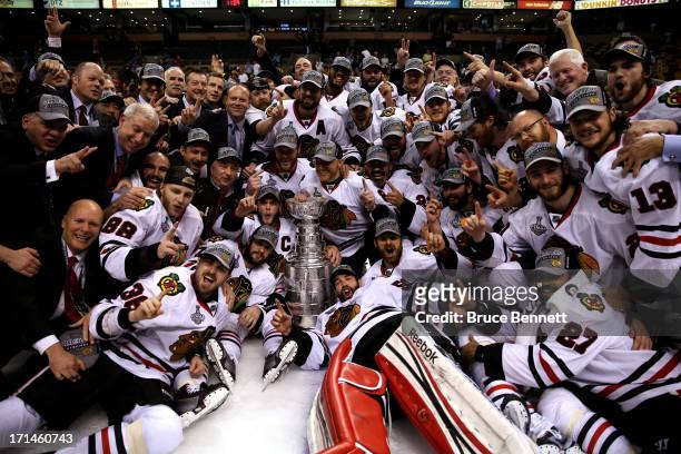 The Chicago Blackhawks pose with the Stanley Cup Trophy after defeating the Boston Bruins in Game Six of the 2013 NHL Stanley Cup Final at TD Garden...