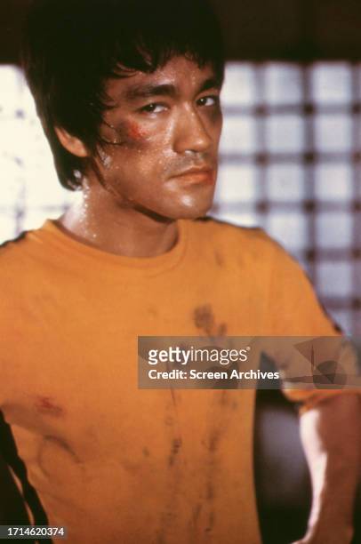 Bruce Lee wearing bloodied yellow Kung Fu tracksuit from the 1978 release 'Game of Death'.