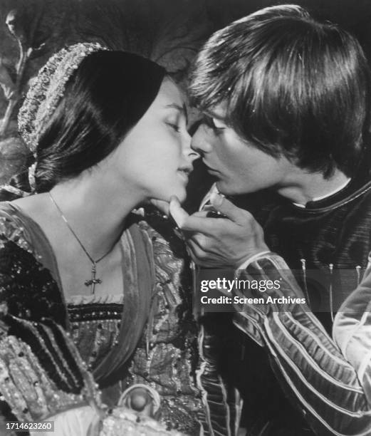 Leonard Whiting and Olivia Hussey kissing in a scene from the Franco Zeffirelli 1968 movie 'Romeo and Juliet'.