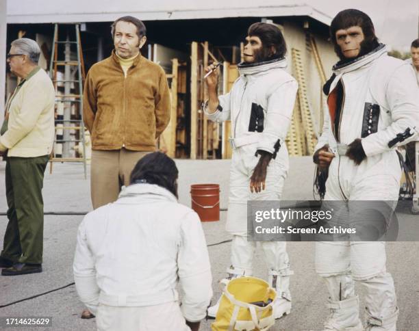 Roddy McDowall and Kim Hunter in space suits on the set of the 1971 movie 'Escape From Planet of the Apes'.