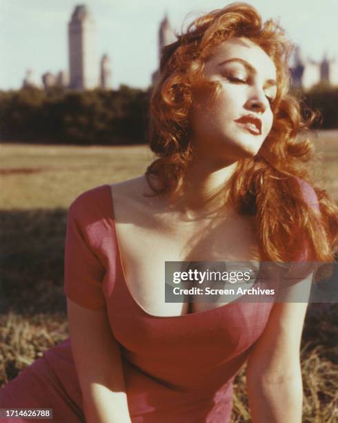 Julie Newmar portrait wearing low cut dress circa 1960.