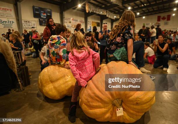 Kids pose for pictures during the Weigh-Off inside the Smoky Lake Arena, on October 7 in Smoky Lake, Alberta, Canada. The 33rd annual Great White...