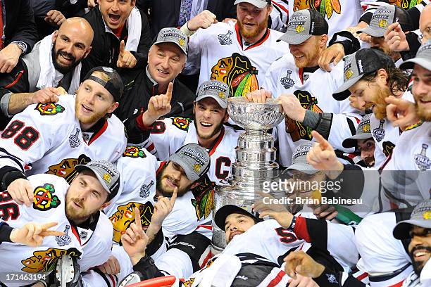 The Chicago Blackhawks poses with the Stanley Cup after the win against the Boston Bruins in Game Six of the Stanley Cup Final at TD Garden on June...