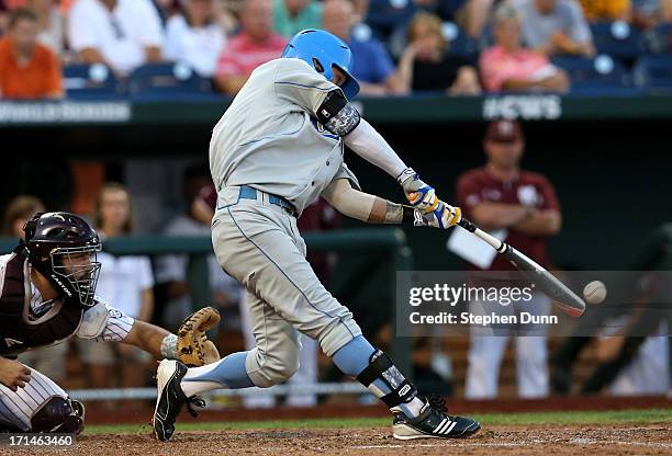 Eric Filia o the UCLA Bruins hits a two RBI single in the fourth inning against the Mississippi State Bulldogs during game one of the College World...