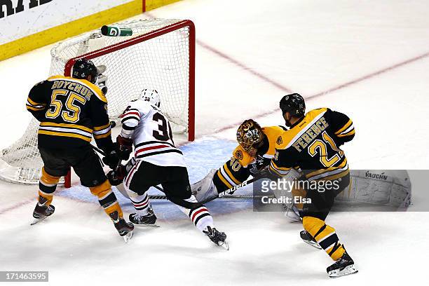 Dave Bolland of the Chicago Blackhawks scores past Tuukka Rask of the Boston Bruins in the third period in Game Six of the 2013 NHL Stanley Cup Final...