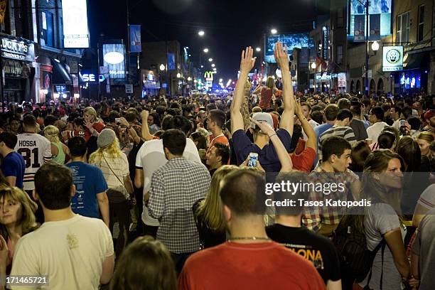 Chicago Blackhawks fans celebrate in the street after defeating the Boston Bruins to win the Stanley Cup on June 24, 2013 in Chicago, Illinois.