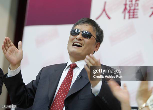 Chinese lawyer and human rights activist Chen Guangcheng gestures to the audience in the Legislative Yuan on June 25, 2013 in Taipei, Taiwan. Chen...