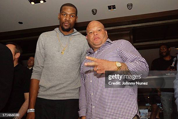 Kevin Durant and Shawn 'Pecas' Costner attend The "Super Heroes" Fundraiser And Domino Tournament at The 40/40 Club on June 24, 2013 in New York City.