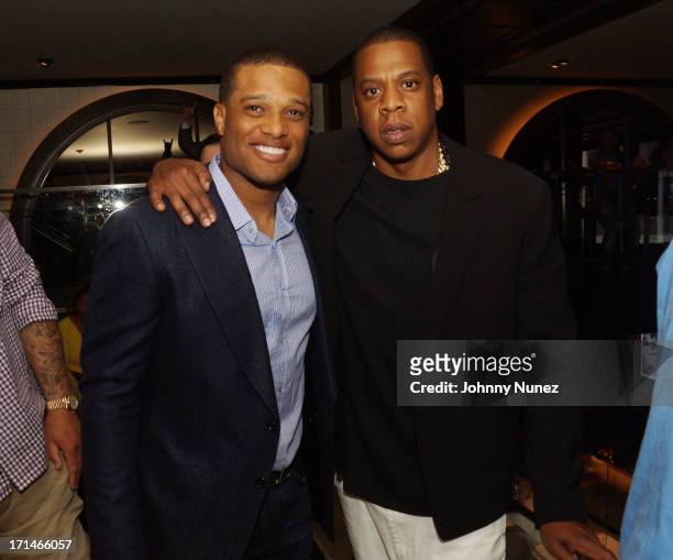 Robinson Cano and Jay-Z attend The "Super Heroes" Fundraiser And Domino Tournament at The 40/40 Club on June 24, 2013 in New York City.