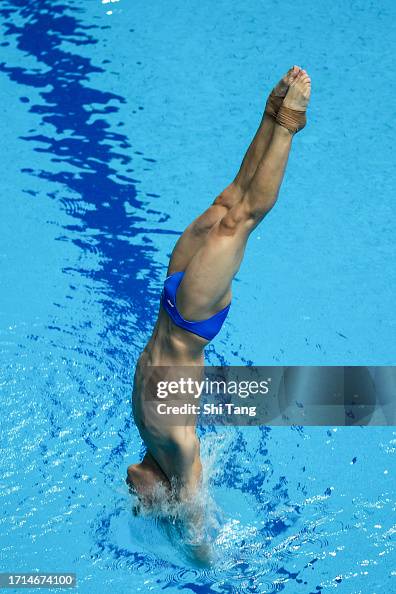 Zheng Jiuyuan of China competes in the Diving Men's 3m Springboard