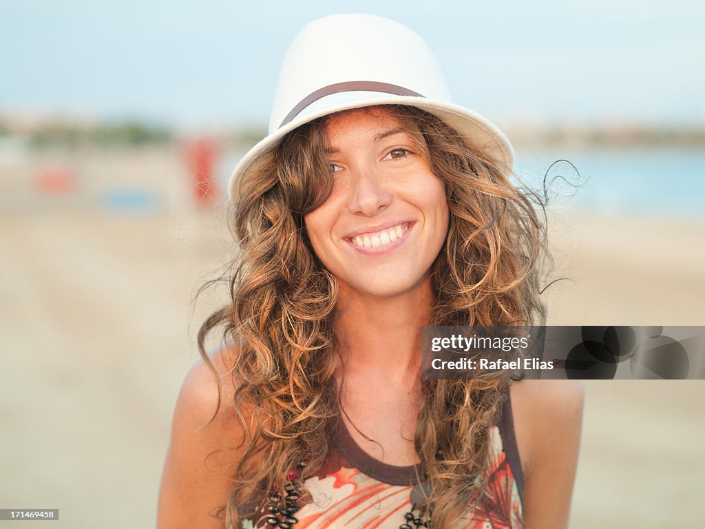 Attractive woman smiling on the beach