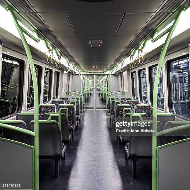 view inside an empty passenger train at night - melbourne train stock pictures, royalty-free photos & images