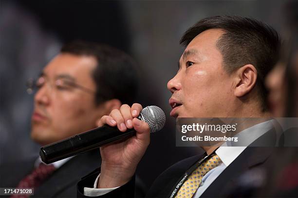 He Jinbi, chairman and chief executive officer of Maike Investment Holding Group Co., speaks during the London Metal Exchange Week Asia 2013 Seminar...