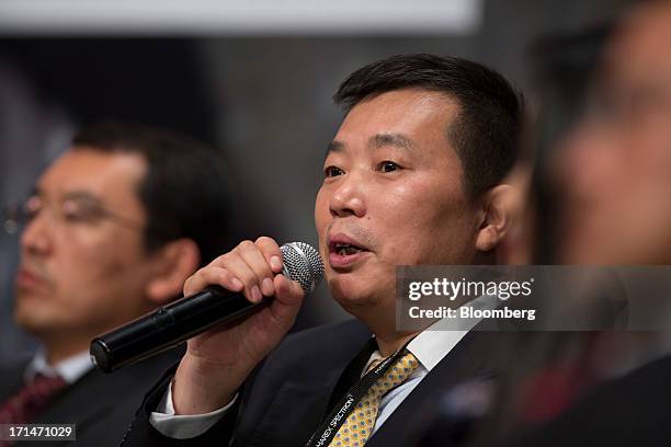 He Jinbi, chairman and chief executive officer of Maike Investment Holding Group Co., speaks during the London Metal Exchange Week Asia 2013 Seminar...