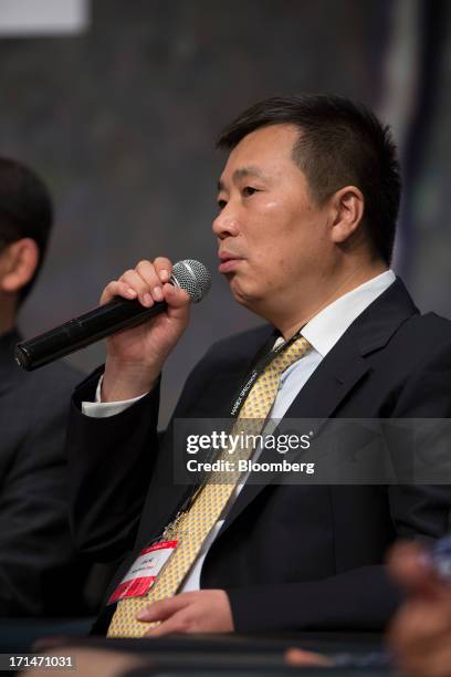 He Jinbi, chairman and chief executive officer of Maike Investment Holding Group Co., speaks during the London Metal Exchange Week Asia 2013 Seminar...