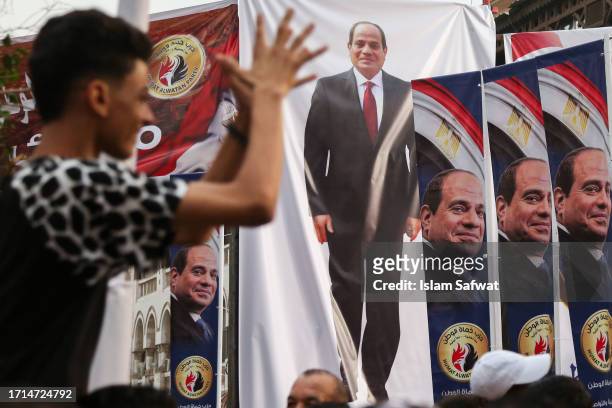 Banners of the Egyptian President Abdel Fattah al-Sisi hang El Korba Square in Heliopolis neighborhood during his supporters' rally as they wait for...