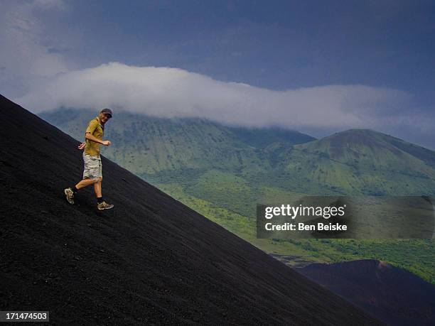 running down the black volcano in nicaragua - nicaragua stock pictures, royalty-free photos & images