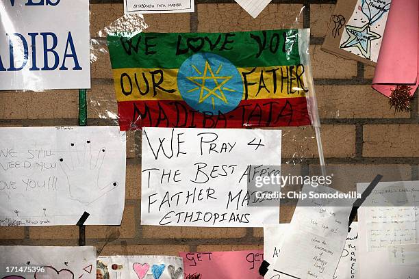 One of the dozens of hand-made messages of support for former South African President Nelson Mandela posted to the wall outside the Mediclinic Heart...