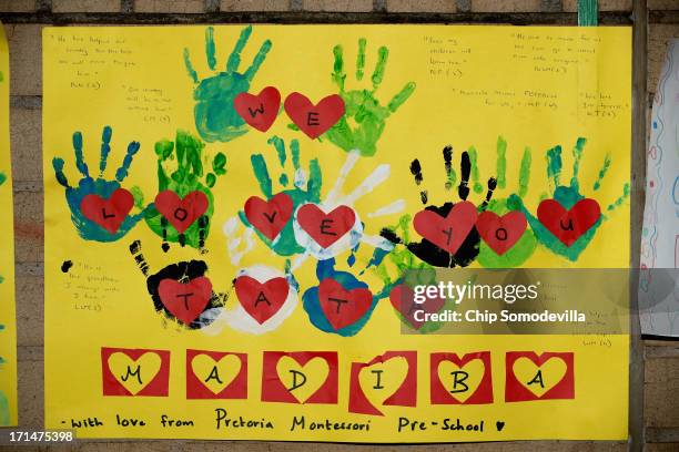 One of the dozens of hand-made messages of support for former South African President Nelson Mandela posted to the wall outside the Mediclinic Heart...