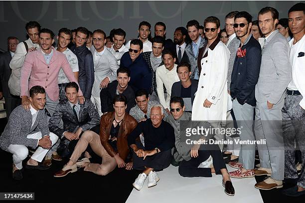 Giorgio Armani and model pose after the Giorgio Armani show during Milan Menswear Fashion Week Spring Summer 2014 on June 25, 2013 in Milan, Italy.