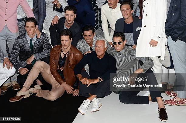 Giorgio Armani and model pose after the Giorgio Armani show during Milan Menswear Fashion Week Spring Summer 2014 on June 25, 2013 in Milan, Italy.