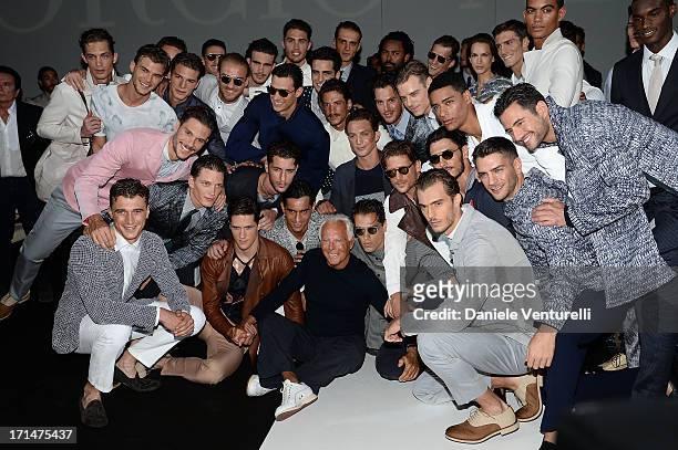 Giorgio Armani and model pose after the Giorgio Armani show during Milan Menswear Fashion Week Spring Summer 2014 on June 25, 2013 in Milan, Italy.