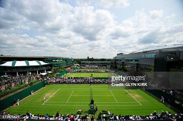 Generall view shows the action on the outer courts on day two of the 2013 Wimbledon Championships tennis tournament at the All England Club in...
