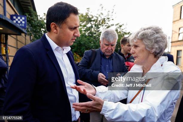 Scottish Labour leader Anas Sarwar talks with a member of the public as he and Scottish Labour candidate for Rutherglen and Hamilton West Michael...