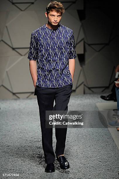 Model walks the runway at the Z Zegna Spring Summer 2014 fashion show during Milan Menswear Fashion Week on June 25, 2013 in Milan, Italy.