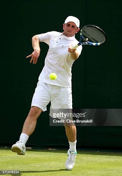 Jesse Levine of Canada plays a forehand during his Gentlemen's Singles first round match against Guido Pella of Argentina on day two of the Wimbledon...