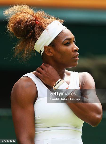 Serena Williams of the United States of America looks on during her Ladies' Singles first round match against Mandy Minella of Luxembourg on day two...