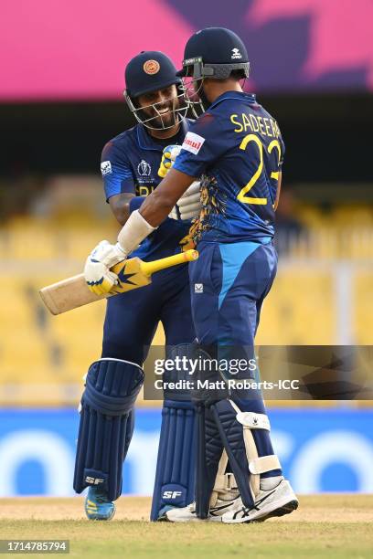 Kusal Mendis of Sri Lanka celebrates reaching his century with Sadeera Samarawickrama of Sri Lanka during the ICC Men's Cricket World Cup India 2023...