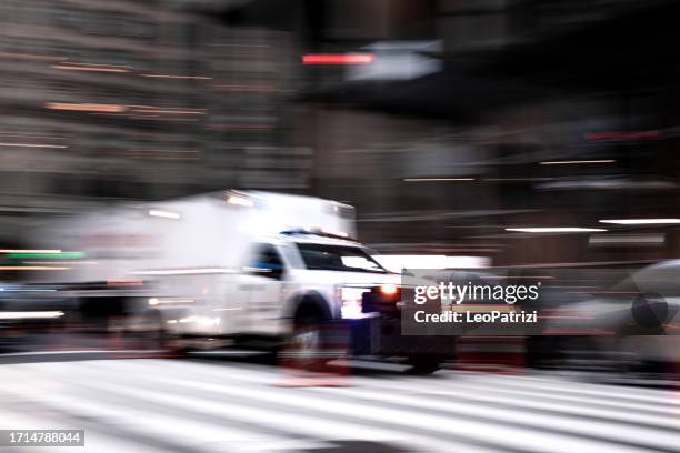 unmarked police van responding to a call in manhattan - police van stock pictures, royalty-free photos & images