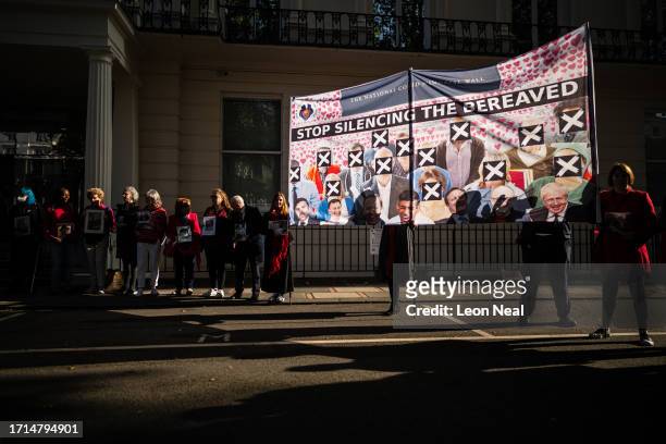 Banner is raised as relatives of those who died during the pandemic gather ahead of the first day of the second phase of the UK Covid-19 public...