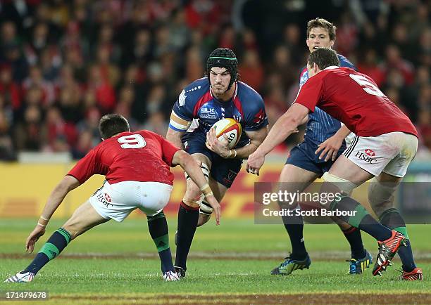 Hugh Pyle of the Rebels runs with the ball during the International Tour Match between the Melbourne Rebels and the British & Irish Lions at AAMI...