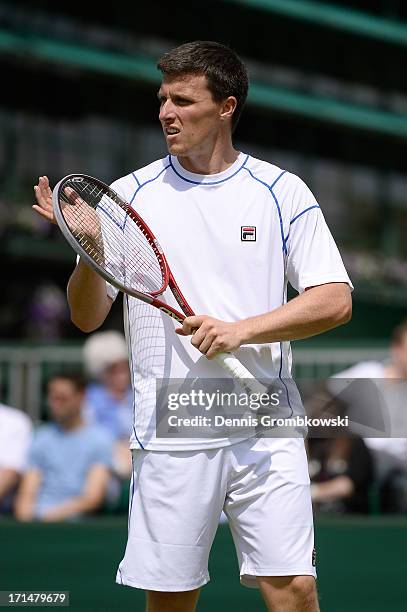 Ken Skupski of Great Britain looks on during the Gentlemen's Doubles first round match between Xavier Malisse of Belgium and Ken Skupski of Great...