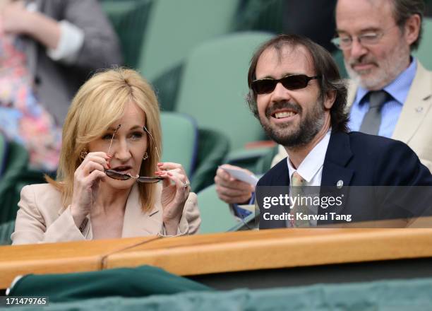 Rowling and husband Neil Murray attend Day 2 of the Wimbledon Tennis Championships 2013 at Wimbledon on June 25, 2013 in London, England.