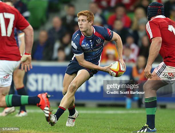 Nic Stirzaker of the Rebels runs with the ball during the International Tour Match between the Melbourne Rebels and the British & Irish Lions at AAMI...