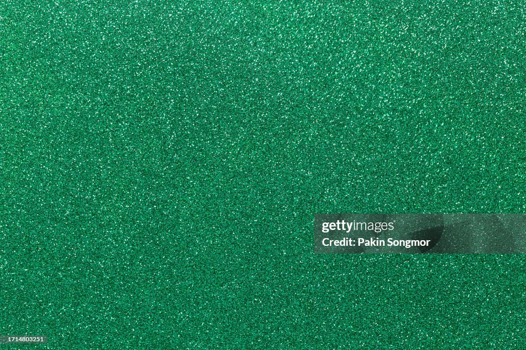 Green color glitter texture Christmas abstract background.
