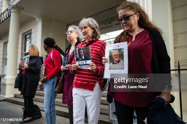Louise Stockwell holds a photograph of her father Jack Stockwell, who died during the pandemic, ahead of the first day of the second phase of the UK...