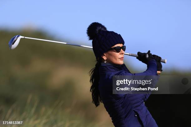 Catherine Zeta-Jones tees off on the sixth hole during a practice round prior to the Alfred Dunhill Links Championship at Kingsbarns Golf Links on...