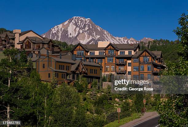 Condominium resort is surrounded by mountains on June 14 in Snowmass, Colorado. Colorado's Rocky Mountains are part of a range that extends 3,000...