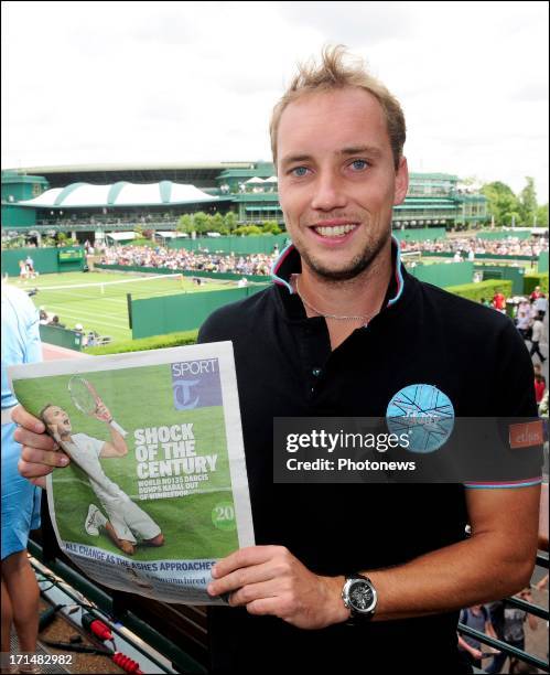 Steve Darcis of Belgium pictured with The Telegraph Sport newspaper, the day after his victory against Nadal on day one of Wimbledon on 25 June, 2013...