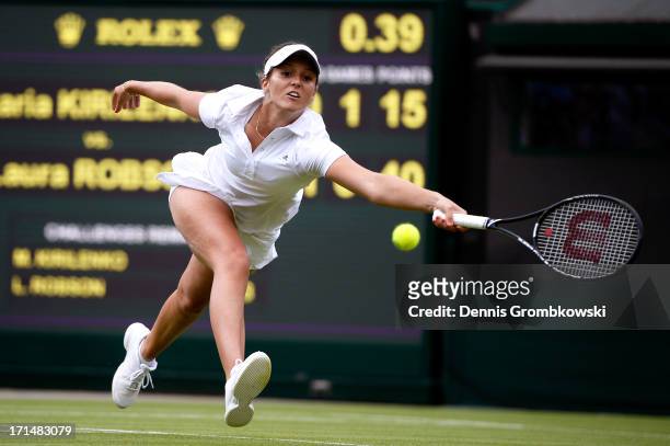 Laura Robson of Great Britain stretches to play a forehand during her Ladies' Singles first round match against Maria Kirilenko of Russia on day two...