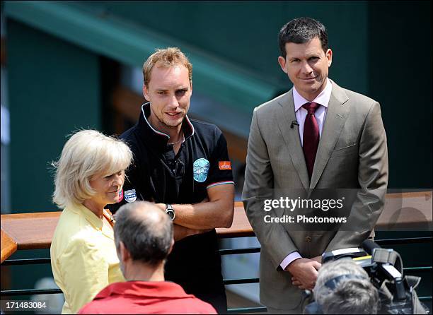 Steve Darcis of Belgium pictured with Sue Barker of the BBC and former tennis player Tim Henman , the day after his victory against Nadal on day one...