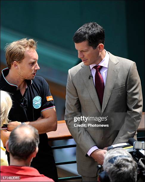 Steve Darcis of Belgium pictured with former tennis player Tim Henman , the day after his victory against Nadal on day one of Wimbledon on 25 June,...